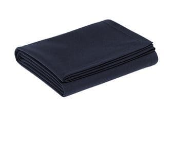 A folded black blanket on top of a white table.