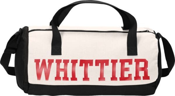 White canvas duffel bag with "Whittier" in red.