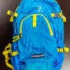 A blue backpack with yellow straps and buckles.
